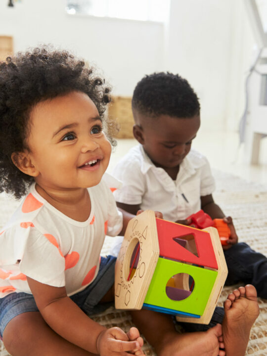 image of children playing with Montessorit toys for 18-month-old.