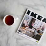 image of cup next to ikea catelog for montessori shopping trip.