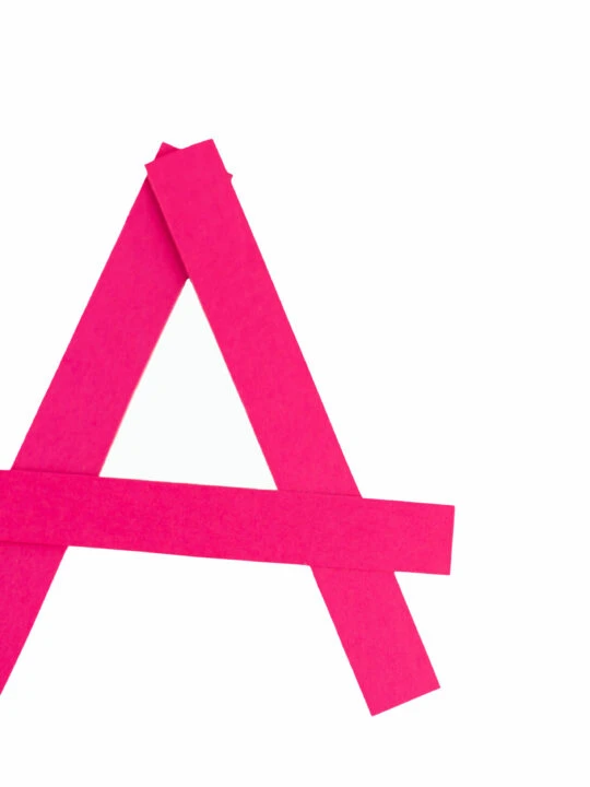 image of a written with tape to represent toys that start with the letter a
