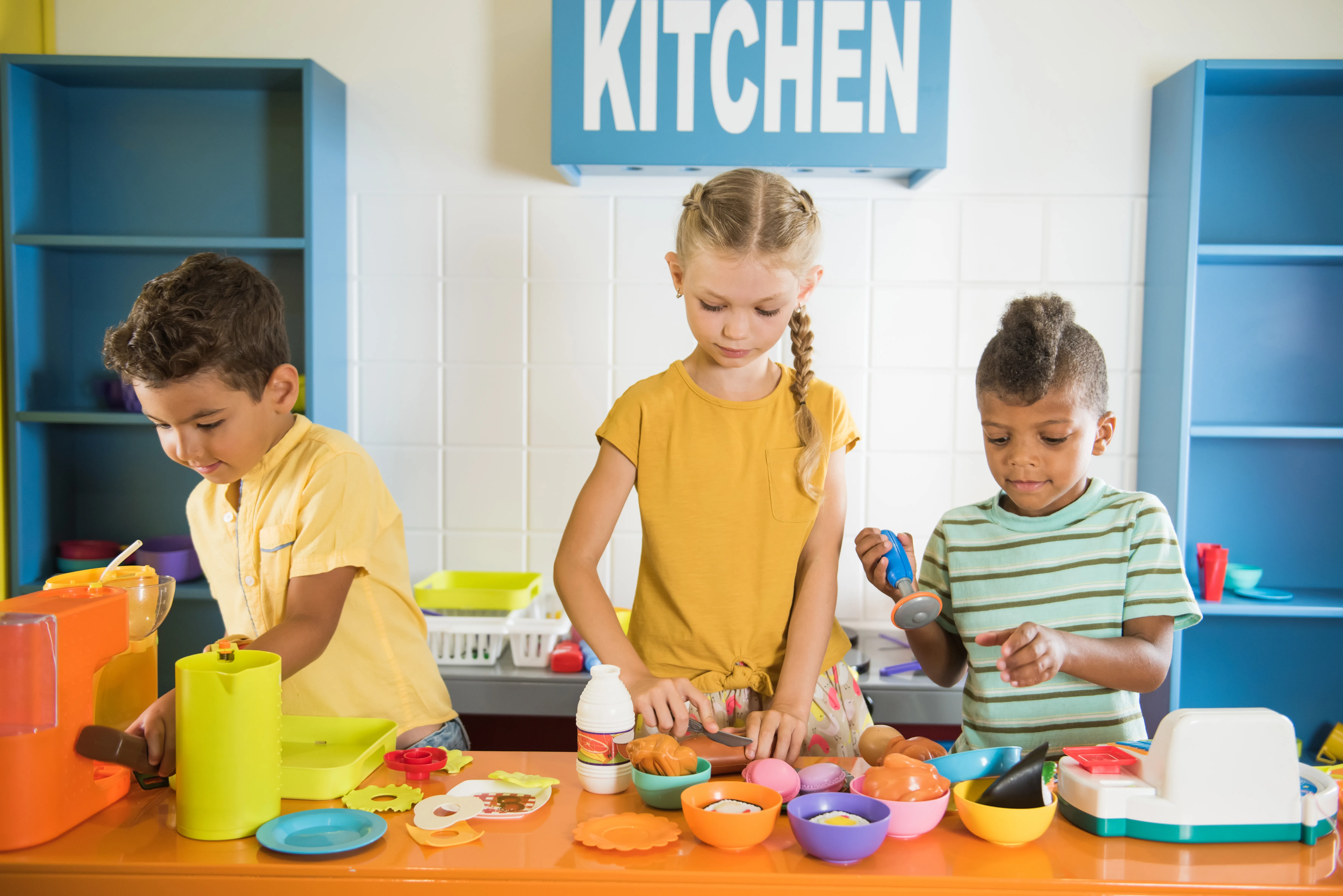 image of children using play food sets.