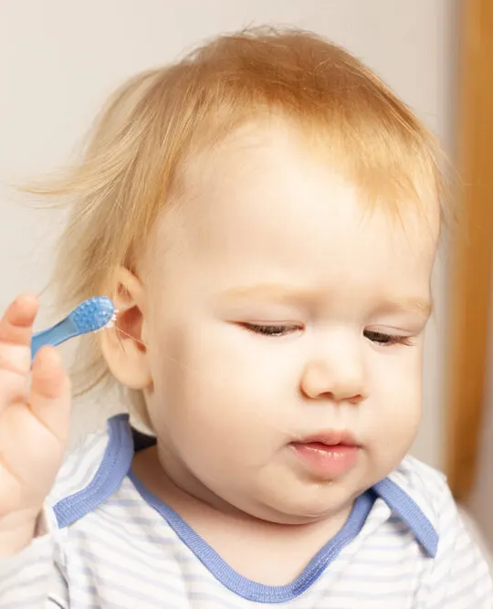 image of child refusing to brush his teeth. Montessori teeth brushing tips will help him.