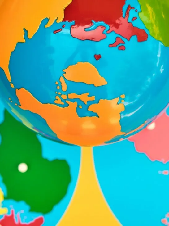 Image of Montessori geography materials, the colored globe and the continent map puzzle.