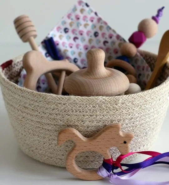 Image of Montessori treasure basket filled with wooden baby toys.