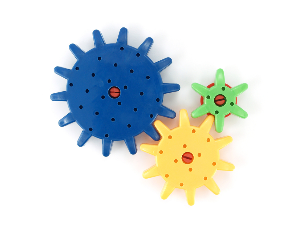 Image of plastic cogs, rotation schema toys.