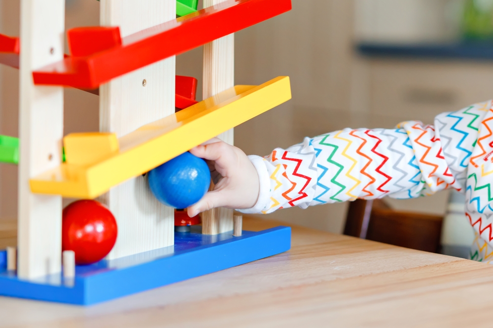 Image if child playing with ball tracker, one of the best trajectory schema toys.