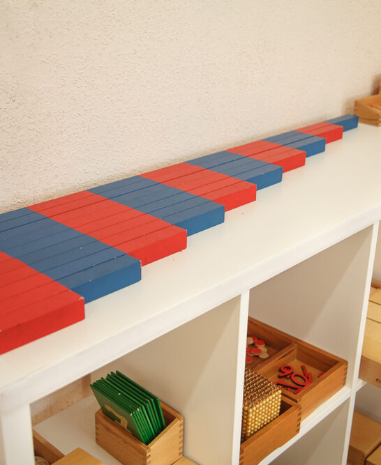 image of a Montessori homeschool room with learning materials on the shelf.