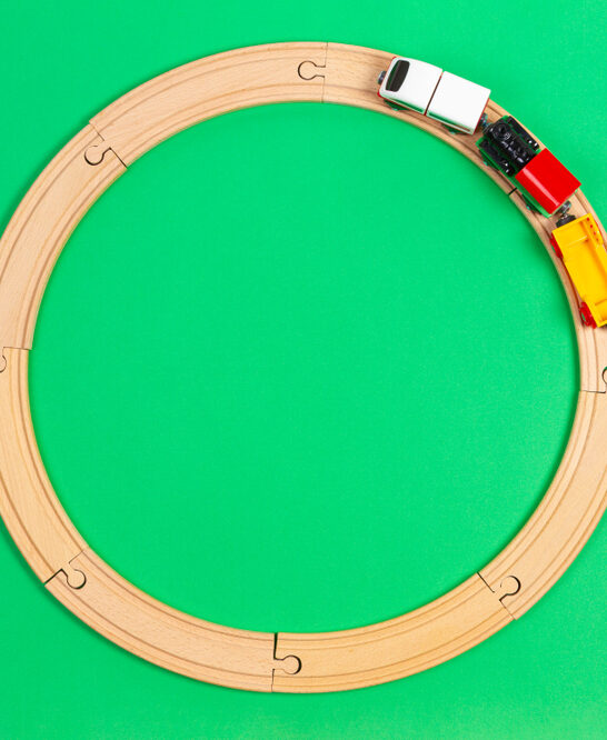 Image of wooden train tracks for Montessori toys for 2-year-olds post header.