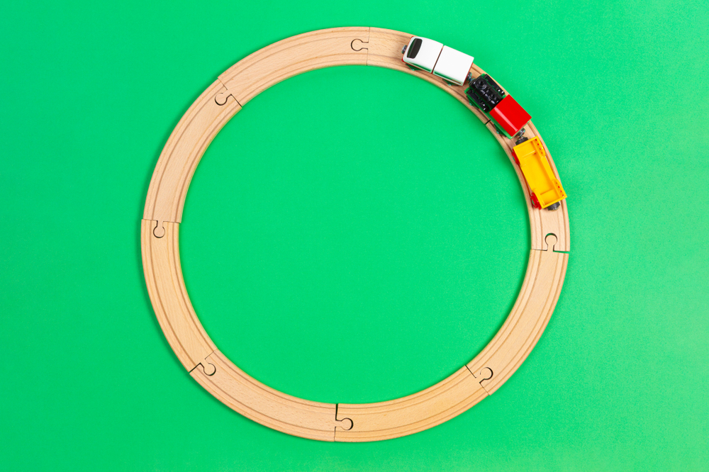 Image of wooden train tracks for Montessori toys for 2-year-olds post header.